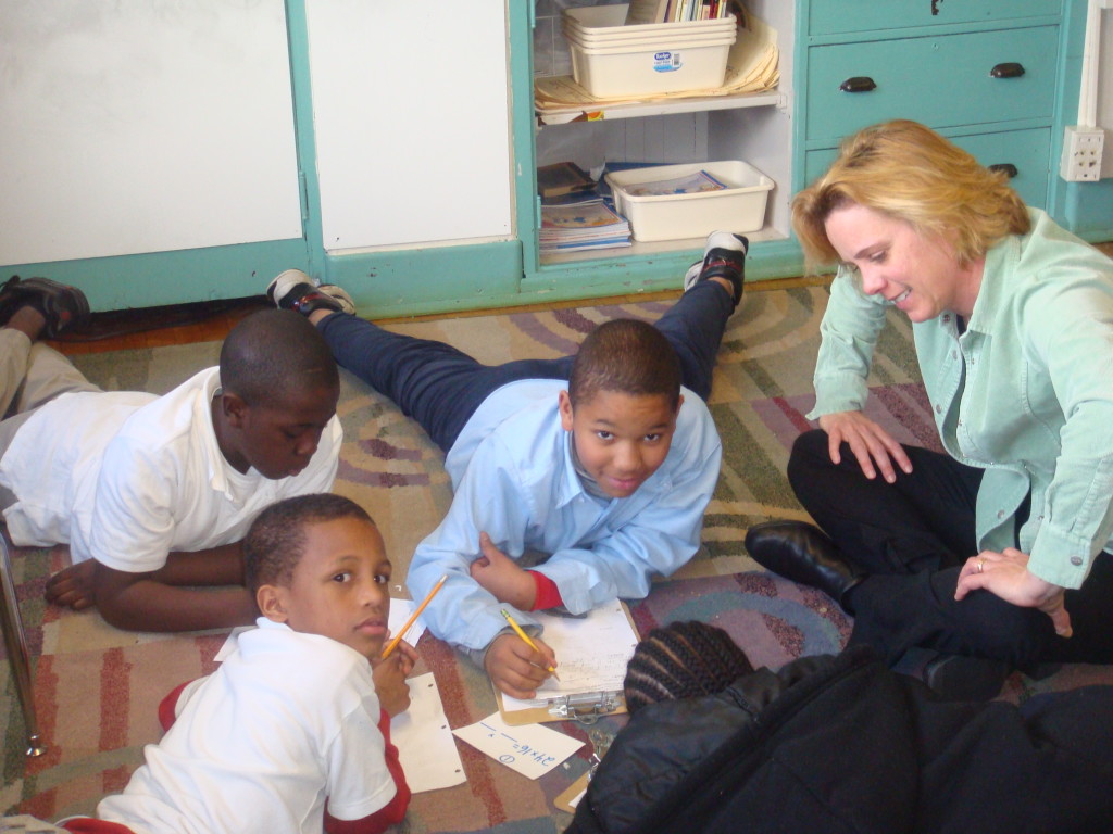 Kathy Strand works with a small group of students in 2008