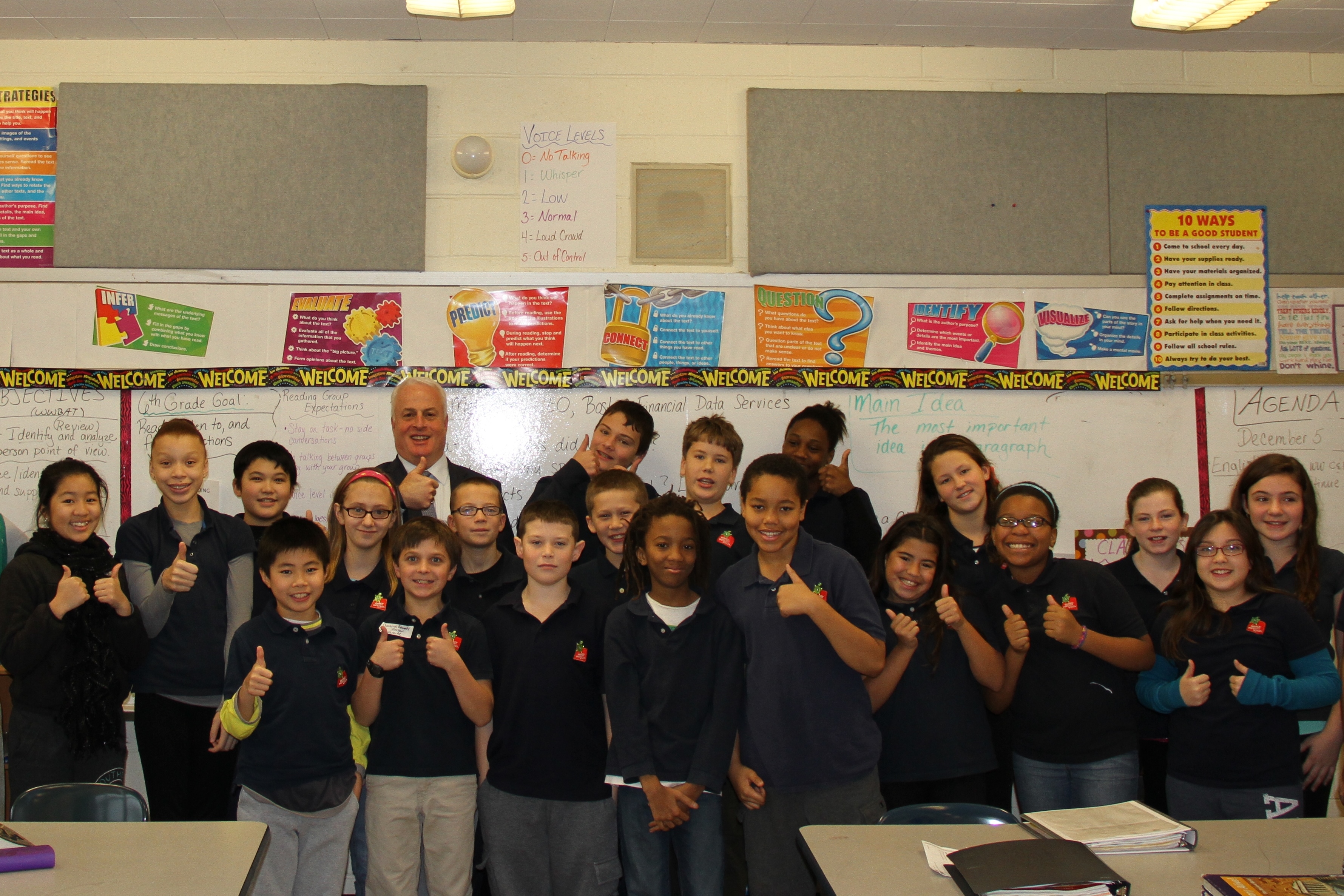 Terry Metzger, President & CEO of Boston Financial Data Services, has a laugh with a 6th grade class at the Warren Prescott School 