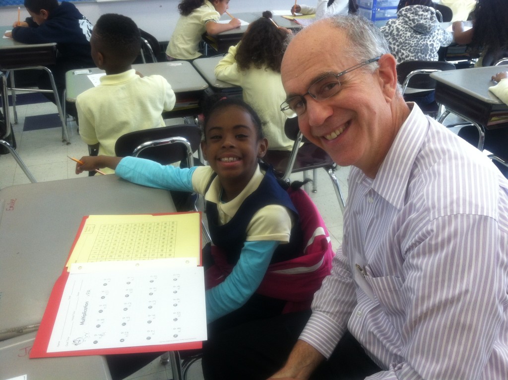 Bob smiles with his math mentee, a 4th gradee at Orchard Gardens K-8 School in Roxbury