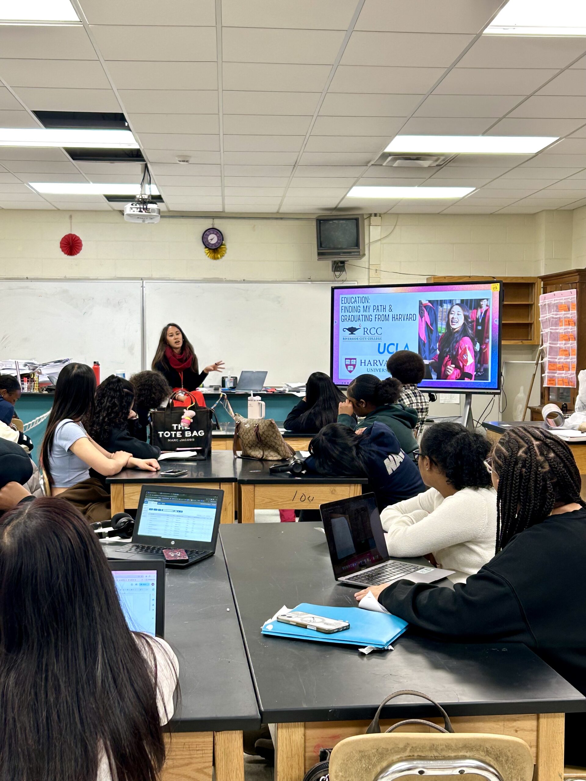 MM1 Sarah Cunningham infront of a third and sixth grade class at Edison k-8 for a Pathfinders visit